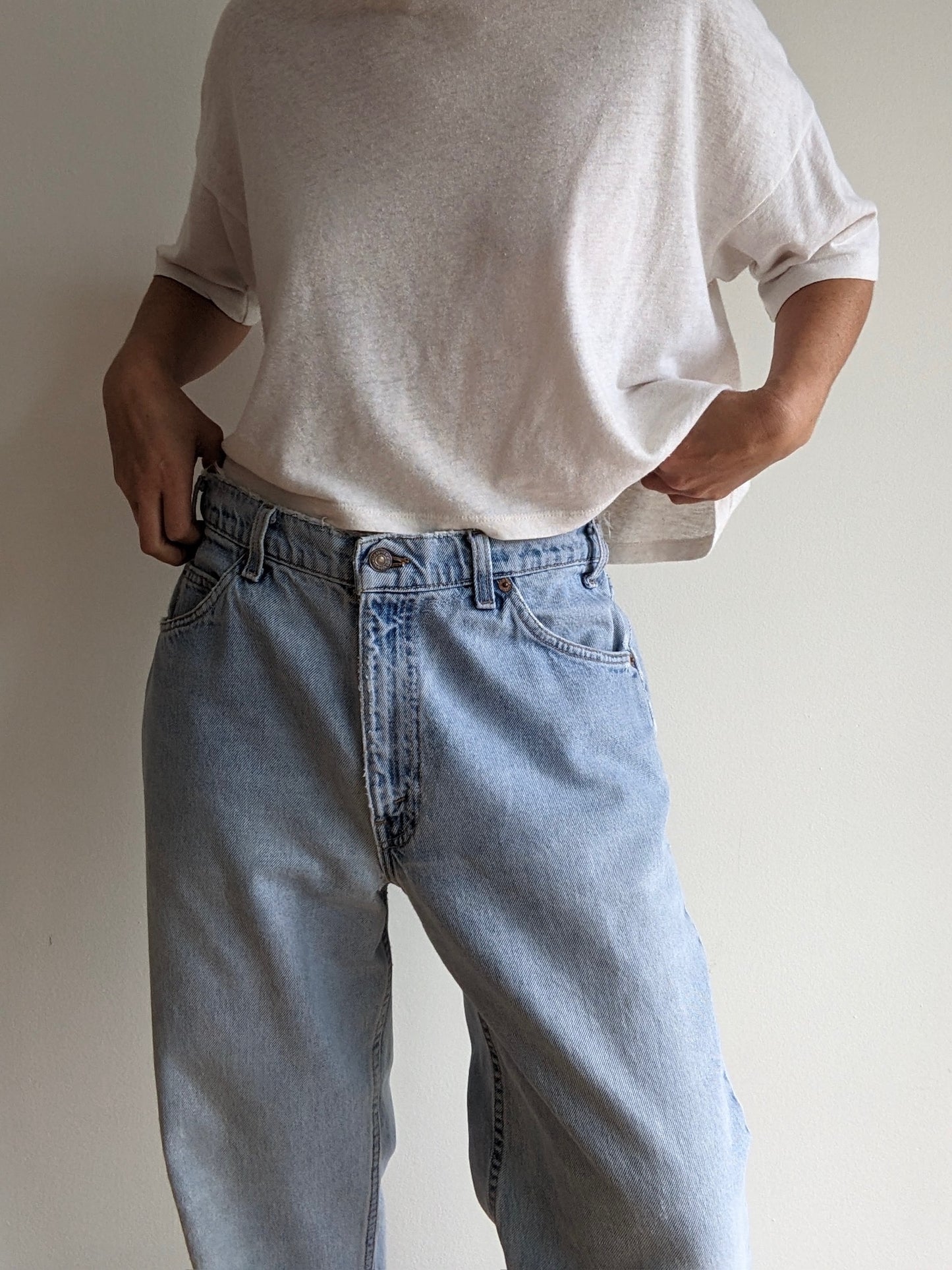 Vintage Levi's Distressed 550 Orange Tab Jeans